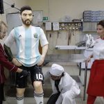 Bakers prepare a life-size chocolate sculpture of Argentine soccer player Lionel Messi to top a cake for the celebration of his upcoming birthday in Moscow